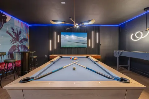 Game room with pool table and shuffleboard