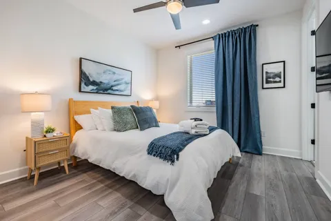 Bedroom 1 with TV and en-suite bathroom