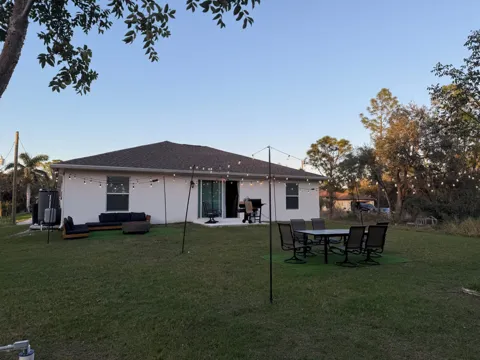 Backyard seating, dining table, fireplace and grill